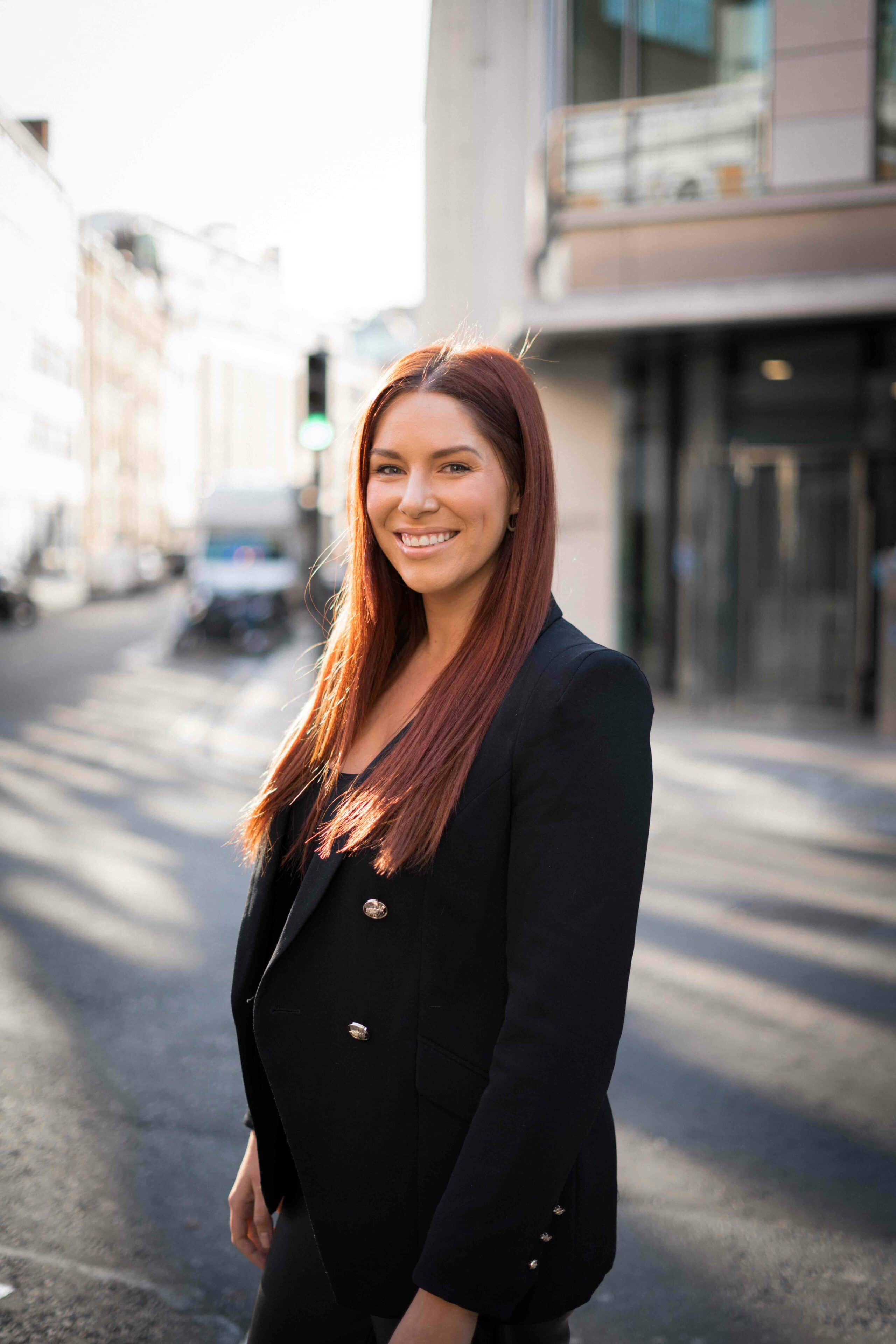 Portrait of a smiling woman with a block jacket
