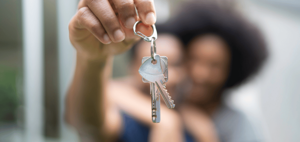 A hand holding the keys