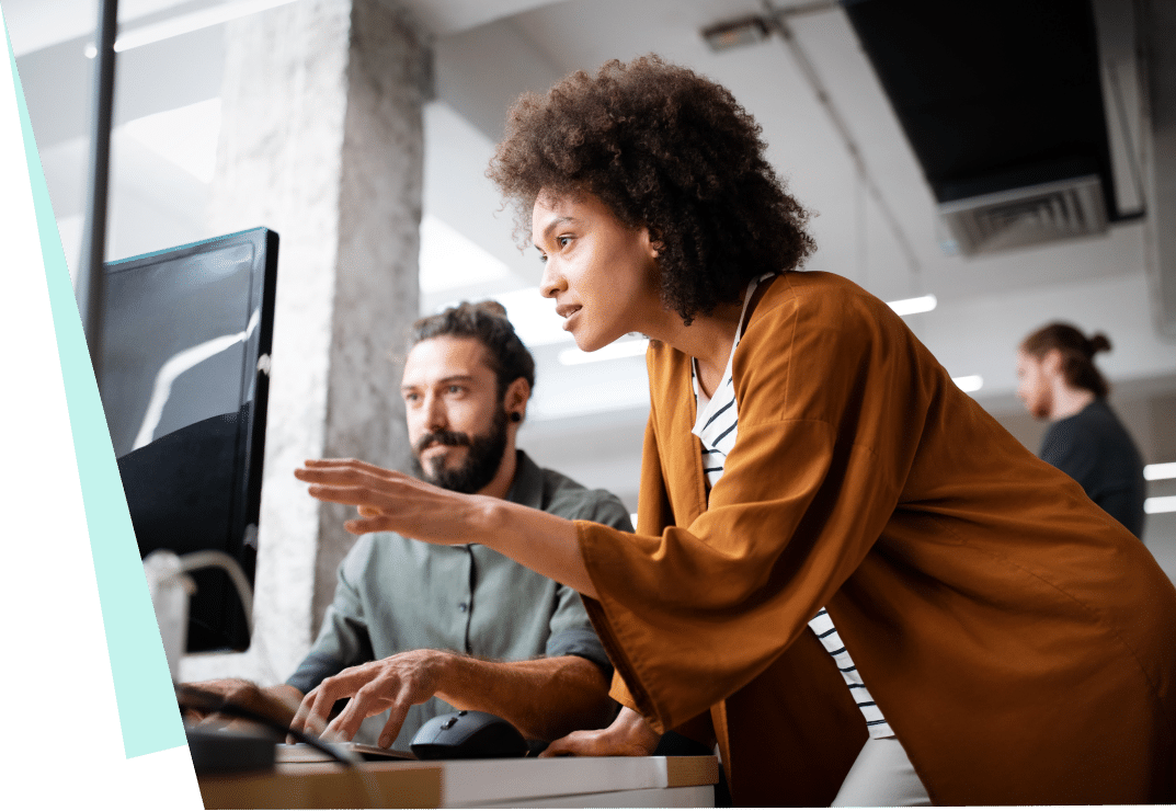 Woman and men speaking in front of computer