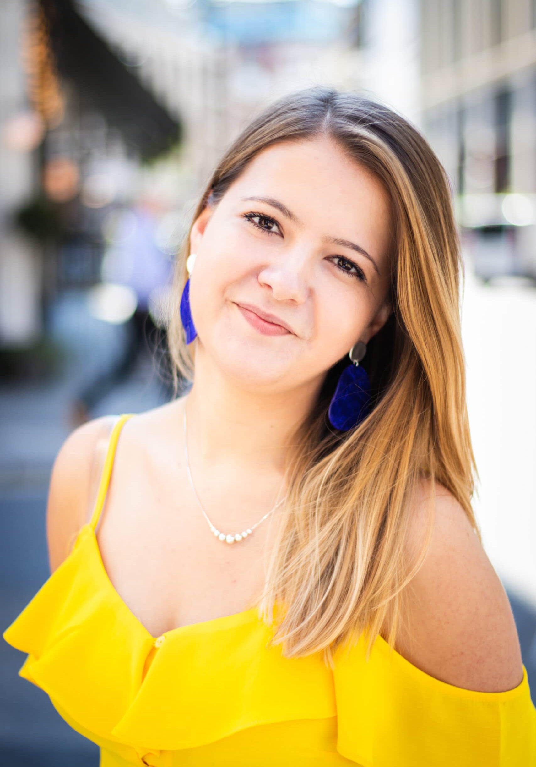 Smiling woman with a yellow top